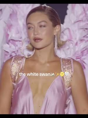 A post by @multiedits.riverdale on TikTok caption: like it always has been #whiteswan #blackswan #gigihadid #bellahadid #models #sisters #hadid #victoriassecret #show #catwalk #lanadelrey #saint #god #angel 