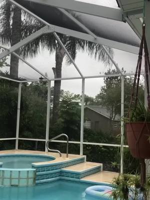 A post by @marchbaby217 on TikTok caption: #hurricanehelene ripped the  the solar panles off of the roof  & #hurricanemilton tore the screens & caused #flooding #prayforflorida 