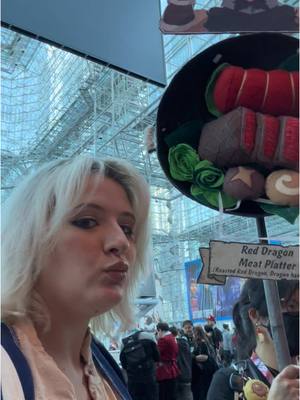 A post by @geek.en.chic on TikTok caption: Getting hungry at con 👀👀 with @littledragonmeiling #dungeonmeshi #cosplay #nycc 