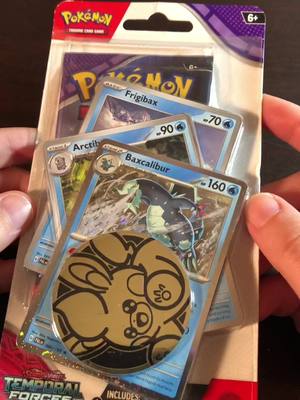 A post by @blueshadowsmoon on TikTok caption: Opening pokemon cards from my good friends @Eros and @M as they gifted this for my birthday! Thank you both! #pokemon #pokemoncards #pokemonscarletandviolet #pokemongo 