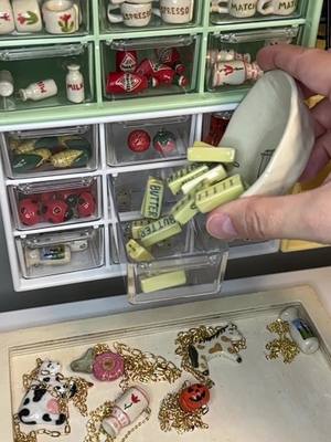 A post by @juiceceramics on TikTok caption: There’s no such thing as too much butter 🧈 #butter #ceramics #jewelry #charms #organizing #asmr