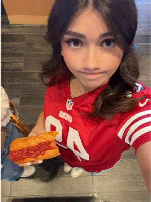 A post by @ginamilesofficial on TikTok caption: hotdog enthusiast #49ers  #footballtiktok #nationalanthem #fyppppppppppppppppppppppp 