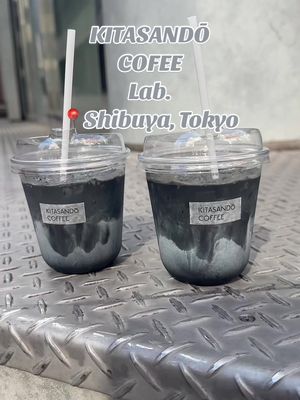 A post by @2truefoodies on TikTok caption: Trying Charcoal Lattes in Tokyo ☕️🖤