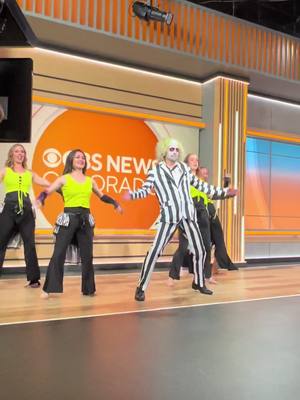 A post by @belladivaworlddance on TikTok caption: Beetlejuice taking over the CBS Morning News show! #beetlejuice #beetlejuicebeetlejuice #belladivaworlddance #denverhalloween 