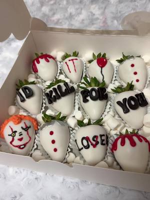 A post by @_xogabbyc on TikTok caption: IT themed strawberries🤡🎈 #halloweenstrawberries #IT #pennywise #drizzleddesserts_ 