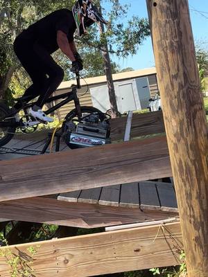 A post by @kamrenlarsen on TikTok caption: Riding my friends backyard! #fyp #bmx 