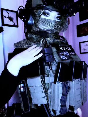 A post by @witchghast on TikTok caption: this song makes me feel like my brain is being cleaned (props! All fake! Safe environment!) #tactical #callofduty #callofdutywarzone #cosplay #fyp #masktok #callofdutyoc #tacticalgear 