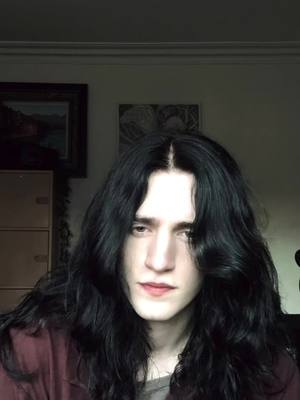 A post by @edward.ironstone on TikTok caption: The angels are watching 👀 #gothboy #longhairmen #vampiregoth #alttiktok #goth 