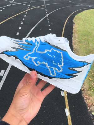 A post by @coreytheeartist on TikTok caption: Final Results of The Detroit Lions Custom af1 🦁🔵🏈🔥 #customshoes #customaf1 #fyp #viral #detroit #detroitlions #nfl #art 