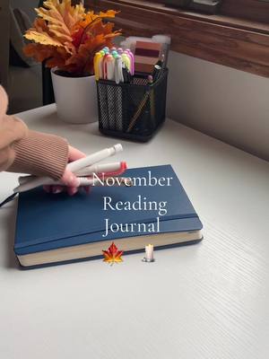 A post by @ilbooksttmats on TikTok caption: November Journal Spread 🕯️🍁 #novemberjournal #november #journaling #journalspread #bookjournal #bookjournalwithme #ilbooksttmats #fallreading #ilovebooks 