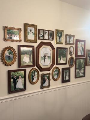 A post by @golfergal on TikTok caption: I wanted our wedding photo wall to look unique, so I thrifted some cool frames and created my dream photo gallery!!!✨🪩🤭 I love things with character and I am having so much fun decorating our house #homedecor #decoration #weddingphoto #thrifted #decor #foryou 