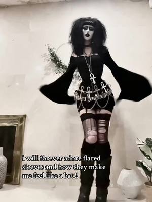 A post by @funeral.vampiress on TikTok caption: 🦇. the way they move when you dance is so ghoulgeous !! . #vampiregoth #tradgothmakeup #deathrockoutfit #romanticgoth #deathrockfashion #tradgothfashion  #vampire #gothoutfit #gothmakeup #deathrocker #tradgoth #gothicrock #goth 