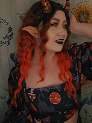 A post by @parkerbliss on TikTok caption: 🐕 Bark bark 🐕 The great thing about being a cosplayer is that everyday can be Halloween 🧡 #tiefling #pumpkinspice #witchy #mocoqueen 