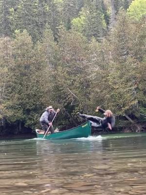 A post by @flylords on TikTok caption: The transition from “hold my beer” to “help me out of this river” happens fast on a canoe. ~ Tag the stuntman in your friend group who’s most likely to end up filling his waders. ~ Check out the Reel of the Week at [FLYLORDSMAG.COM].  ~ 🎥: @alexis.pageau @hooke.ca @saumonquebec ~ #flylords #flyfishing #fail #canoefishing