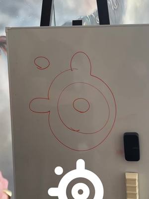 A post by @steelseries on TikTok caption: i asked some of my coworkers to draw the SteelSeries logo from memory... embarrassing or impressive?