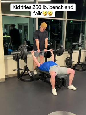 A post by @david_randall on TikTok caption: Guy tries to bench 250 pounds and brutally fails. #benchpress #fail 