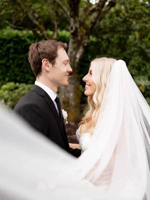 A post by @hayleylowee on TikTok caption: They say rain on your wedding day is good luck 🤞🏻  Photography: @photosbykaitstober  #wedding #seattle #bride #bridesoftiktok #bridetiktok #weddingtiktok #weddingdetails 