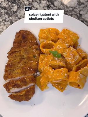 A post by @dineinwithdenise on TikTok caption: Recipe Video for this amazing Spicy Rigatoni and Chicken Cutlets!! 🤩This is my first voiceover so y’all bear with me! 😅😅 Let me know in the comments if you have any questions and what y’all want me to make next! #spicyrigatoni #chickencutlets #chickenrecipes #dallasfoodie #pastarecipe