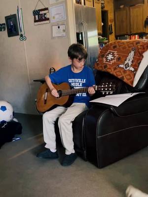 A post by @mama_bear3136 on TikTok caption: My 12 year old learning amzing grace on guitar. Show him some love. 