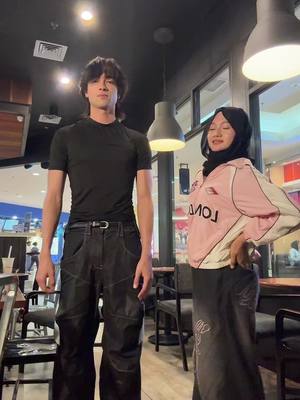 A post by @sebastianmoy on TikTok caption: the height difference 🥲@dinnaputriparker 