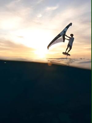 A post by @ion.club on TikTok caption: When the sunset meets the freedom of wingfoiling 🌅✨  #wingfoil #IONCLUB #sunset #capeverde #caboverde #salisland