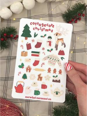 A post by @narwhalcarouselco on TikTok caption: I’m dreaming of Christmas stickers today and every day until Christmas! 🎄 I have 13 more holiday market days this season, so I’ve pretty much been making stickers from the moment I get up until I go to sleep, and it’s been so fun! 🎁🎄☃️❄️🎅🏼