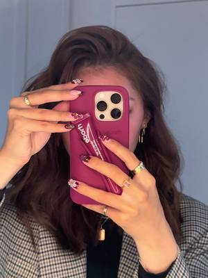 A post by @notdebra on TikTok caption: Obsessed with my new @rhode skin fall phone case 🎀✨  #phonecase #rhode #rhodephonecase #rhodecases #rhodefall #fallaesthetic #fallfashion #lipgloss #justgirlythings #girlygirl #itgirl #pinterestinspired #pinterestgirl #unboxing