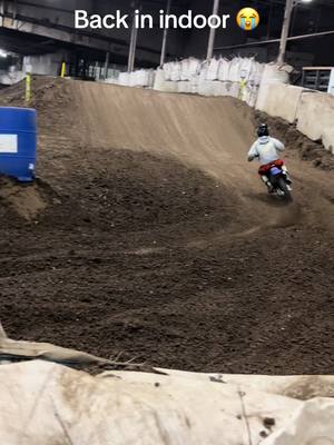 A post by @ryanadelmann_928 on TikTok caption: Back indoor kinda sad but at least i can ride this place kinda sucks old layout was better #dirtbike 