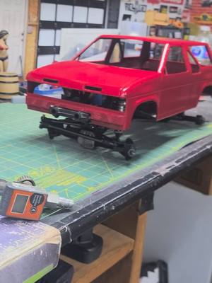 A post by @schmeed81 on TikTok caption: 3d printed nissan pathfinder fresh outta the booth. 1/10 axial scx10.2 chassis. #projects #DIY #rccars #hobby #rc #paint #scx10.2#axial #3dprinting 