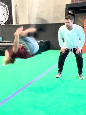 A post by @chrishemsworth on TikTok caption: Just teaching my young bloke the true technique on how to backflip. Kinda like yoda/skywalker #haterswillsayitsfake 