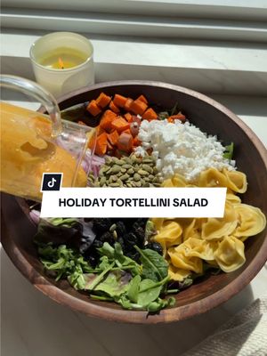 A post by @healthygirlkitchen on TikTok caption: HOLIDAY TORTELLINI SALAD (with pumpkin vinaigrette!) 🌿✨#EarthboundFarmPartner  You have to make this salad for the holidays!! Omg it’s so good. As a busy mom, the organic pre-washed greens from @Earthbound Farm are truly life saving.  Ingredients:  2 cups organic baby red butter + arugula mix @earthboundfarm  1 cup organic baby spinach  3 cups cooked tortellini  1-2 cups roasted sweet potato  1/2 cup sliced red onion  3/4 cup vegan feta  1/4 cup dried cherries  1/4 cup pumpkin seeds  Dressing: 1/3 cup pumpkin 1/4 cup olive oil 2 tbsp white wine vinegar 1 tbsp tahini 1 tsp dijon Dash of pepper 1 tsp salt 1 tsp garlic powder 2 tbsp water to thin  #salad #thanksgivingrecipes #healthyrecipes 