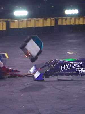A post by @battlebots on TikTok caption: 💥 CRASH! Glass shatters, lights explode, and chaos reigns as Hydra sends Mad Catter flying into the screws! 😱 Can Mad Catter claw its way back? Hydra’s not unscathed either—this one’s far from over. Watch the full wild fight on our YouTube channel now. #BattleBots