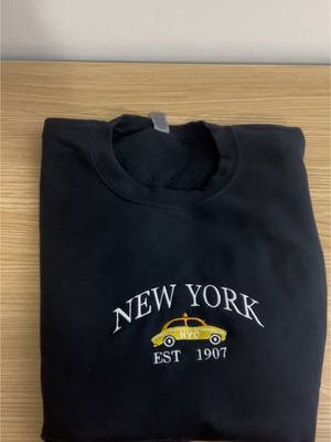 A post by @embroi..luxe on TikTok caption: #fyp #sweatshirt #embroidery #newyork #newyorkcity 