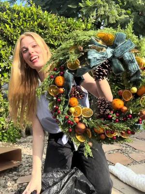 A post by @thegigigoode on TikTok caption: Look at the wreath my mom made me !!! 😭 #holiday #decor #christmas #festive 