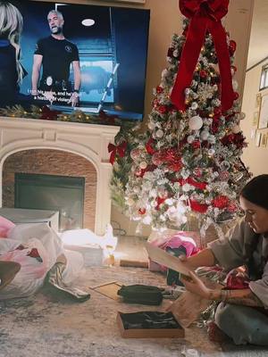 A post by @christalbug on TikTok caption: Watch me wrap a few gifts for our 3 kids, also peep steve the bearded dragon. Our house is chaotic #christmas #christmascountdown #christmaswrapping #wrappinggifts #christmasdecor 