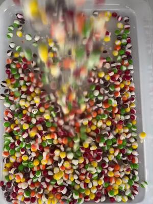 A post by @nicospicks6 on TikTok caption: Omg😍rainbow candy waterfall 😍!!!!!!🍎🍐🍊🍋🍋‍🟩🍌🍉🍇🍓🫐🍈🍒🍑🥭🍍🥝🌈