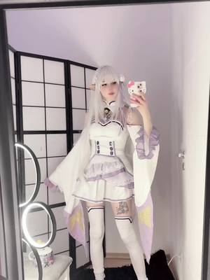 A post by @dollycosplays_ on TikTok caption: #emilia #emiliacosplay #rezerocosplay #rezeroemilia #rezeroemiliacosplay 