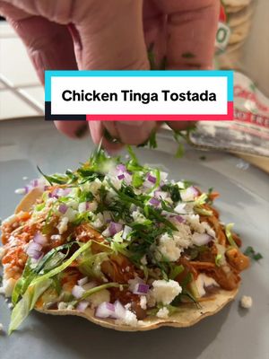 A post by @oscarins_kitchen on TikTok caption: Can’t go wrong with a classic Chicken Tinga Tostada. Down below are the measurements for the sauce.  Chicken Tinga Sauce  Ingredientes: 6 - California Chilis  2 - Large Tomatoes  1/4 - Yellow Onion  8 - Garlic Cloves  5 - Chili de Árbol  4 - All Spice Seeds  3 - Cloves  1tsp - Cumin Seeds  2tsp - Oregano  1 tablespoon - Chicken Tomato Bouillon  2.5 cups - Water  7 - Chicken Thighs (shredded) #EasyRecipe #chicken #tinga #mexicanfood 