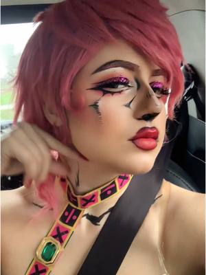 A post by @baron.cosplays on TikTok caption: QUEEN. NEVER. CRY. #trishuna #trishcosplay #jojosbizarreadventure #jjba #jojos #mcmbirmingham @MCM Comic Con 