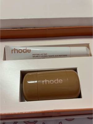 A post by @lifewmichale on TikTok caption: First rhode purchase! It smells sweet 🤎 #rhode #makeup @Hailey Bieber 