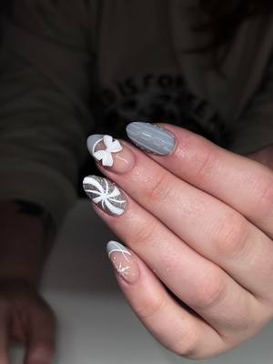 A post by @danyfloresnails on TikTok caption: xoxo 🤍 #christmas #nails