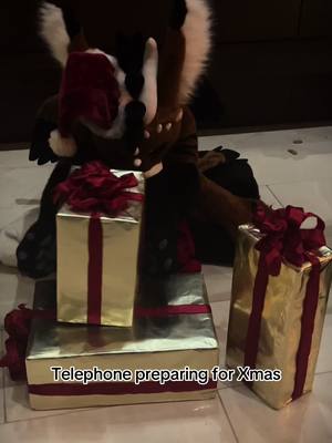 A post by @phoenixawoo on TikTok caption: What do you think she packed in those gifts? #telephone #fursuit #furry 