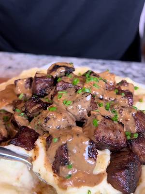 A post by @eatwitzo on TikTok caption: Steak bites and Mashed potatoes 🥩🥔  These two were made for each other, the peppercorn cream sauce is what really sets it off! Enjoy!  Full Ingredient List:  1-1.5 lb steak bites  1-2 tsp garlic powder  1-2 tsp black pepper  1.5-3 tsp salt (optional)  1-2 garlic cloves  2 tbsp butter  For mashed potatoes:  6-8 medium sized yukon gold potatoes peeled  1/4-1/2 cup heavy cream  1/2 stick butter  1/4 cup sour cream  1 tbsp garlic paste  Salt to taste Pepper to taste  For peppercorn sauce:  1/4 cup finely diced onions or shallots  1 medium garlic clove  15-20 crushed peppercorns  2-3 dashes Worcestershire sauce  1-2 tsp flour  Salt to taste (optional)  Chives to garnish #steakbites #mashedpotatoes #eatwitzo 