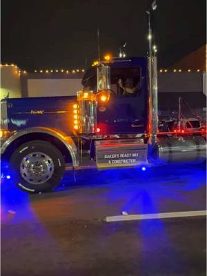 A post by @brockbaker54 on TikTok caption: Our 589 Peterbilt Blue Angel in the Christmas Parade monday night! #BRM #peterbilt 