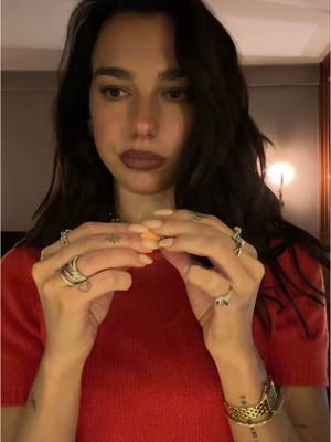 A post by @dualipaofficial on TikTok caption: me last night raiding yigit & giuliano's snack draw