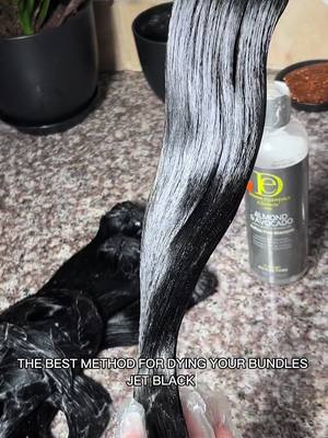 A post by @ms.tailaa on TikTok caption: WERE LEAVING ADORE DYE IN 2024! What do you use to dye your hair? If you’re not using Bigen Black for the perfect jet black on your bundles and extensions, you’re missing out! I only used 3 boxes to dye 4 bundles of my Isla Indonesian Wavy.  Final restock of Isla Indonesian extensions: 12/15 at 12 PM EST! Don’t wait—it won’t return until next winter. Plus, we’re adding one of our Isla Indonesian hair suppliers to our personal vendor list download! 👀  #vendorslist #rawhairextensions #hairinfluencer #hairdye #wigmaker 