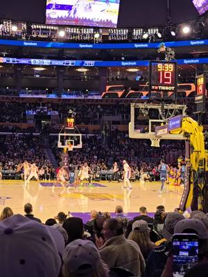 A post by @nickthetraveler on TikTok caption: 2nd Game today and now I am watching my Lakers. Sitting on the floor behind the basketball is a cool perspective. Laker will win tonight.#