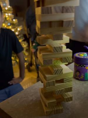 A post by @http.julievargas on TikTok caption: Didnt end so well for x🥲 #beanboozledchallenge #jenga #viral #boredgames #family #funny #christmas #throwup 