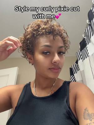 A post by @lovelyyy.mia on TikTok caption: Give me some good curly hair products i can use pleaseeee😣😣😣 #fyp #pixiecut #curls 