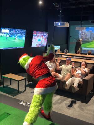 A post by @jamescapener on TikTok caption: Grinchy visits Australia’s favourite indoor golf and bar venues! @X-Golf Australia #8daysleft #christmas @Gloria Boyd #grinchytoksocks #rockingham #fyp #golf #golftiktok 